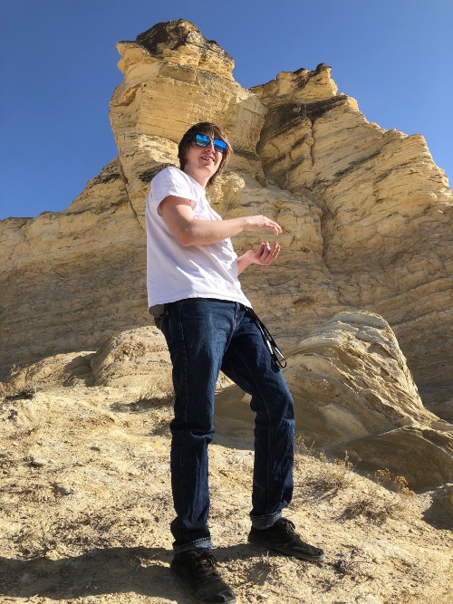 me standing in front of a huge rock